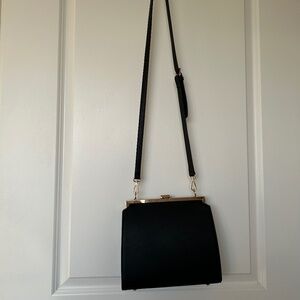 Anthropologie black aota Nicky shoulder bag.